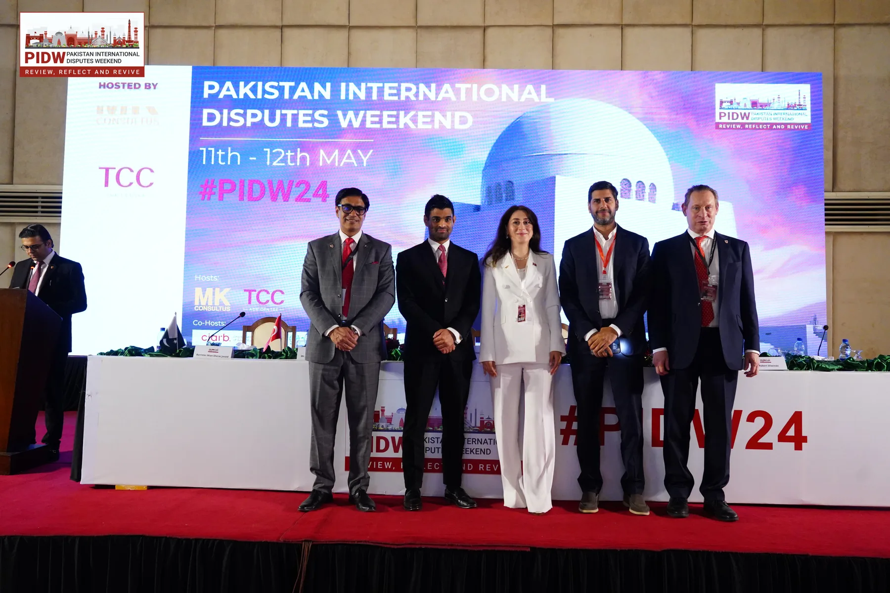 PIDW24 participants gathered on stage in Karachi.